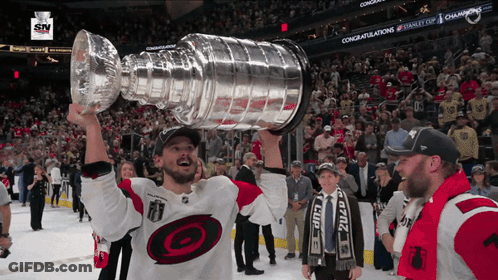 Hockey Player Holding Trophy GIF