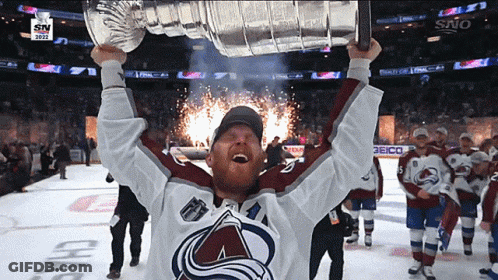 Hockey Player Holding Trophy GIF