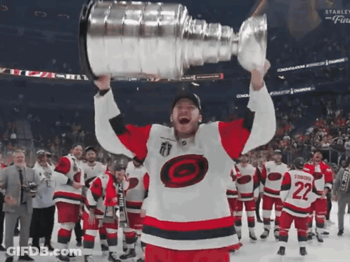Hockey Player Holding Trophy Number 22 GIF
