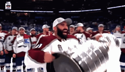 Hockey Player Holding Trophy GIF