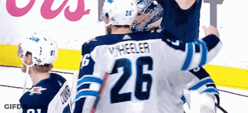Hockey Player Hugging Another Player GIF