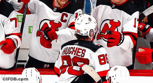 Hockey Player Hughes Congratulated By Teammates GIF
