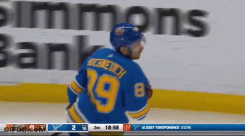Hockey Player In 18 Jersey Beside Another GIF