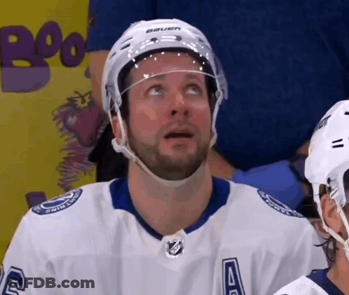 Hockey Player In Bauer Helmet Looking Up GIF