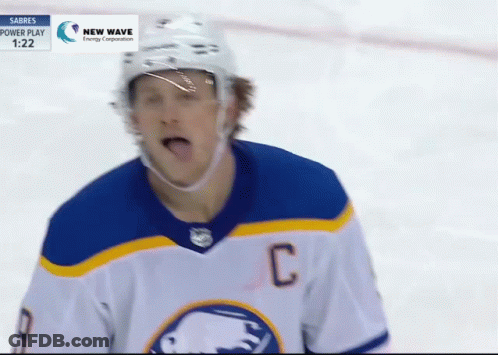 Hockey Player In Blue And White Jersey With C GIF