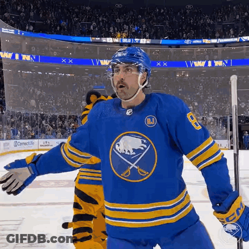 Hockey Player In Blue And Yellow Jersey GIF