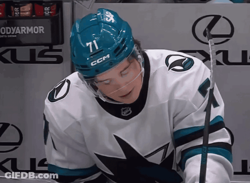 Hockey Player In Blue Helmet Number 71 GIF