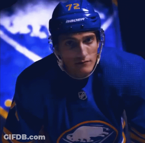 Hockey Player In Blue Jersey And Helmet GIF