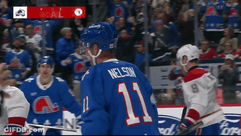 Hockey Player In Blue Jersey Number 11 GIF