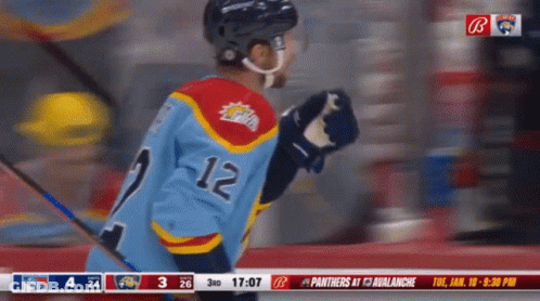 Hockey Player In Blue Jersey Number 12 GIF