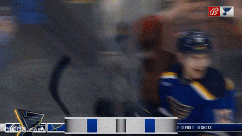 Hockey Player In Blue Jersey Number 13 GIF