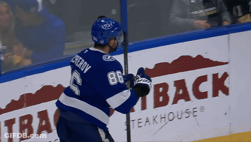 Hockey Player In Blue Jersey Number 2 GIF