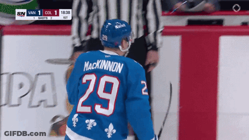 Hockey Player In Blue Jersey Number 29 GIF