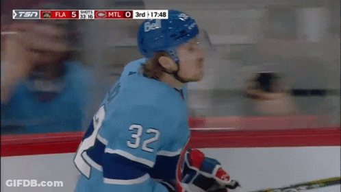 Hockey Player In Blue Jersey Number 32 GIF