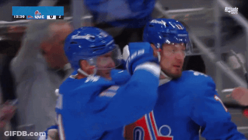 Hockey Player In Blue Jersey With A GIF