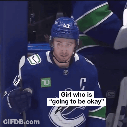 Hockey Player In Blue Jersey With C GIF