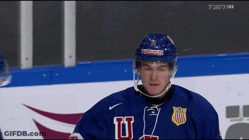 Hockey Player In Blue Jersey With Letter U GIF
