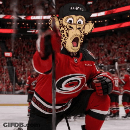 Hockey Player In Cheetah Mask Holding Stick GIF