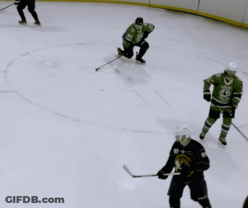 Hockey Player In Dallas Jersey Holding Puck GIF