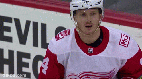 Hockey Player In Front Of Evil Sign GIF