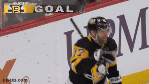 Hockey Player In Front Of Goal Sign GIF