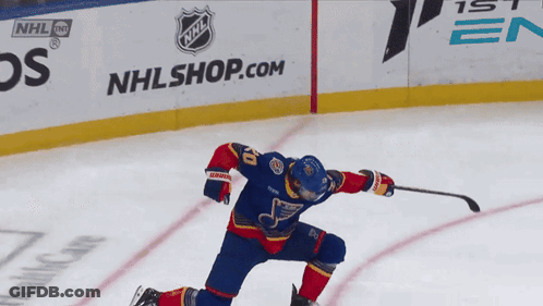 Hockey Player In Front Of NHL Shop Sign GIF
