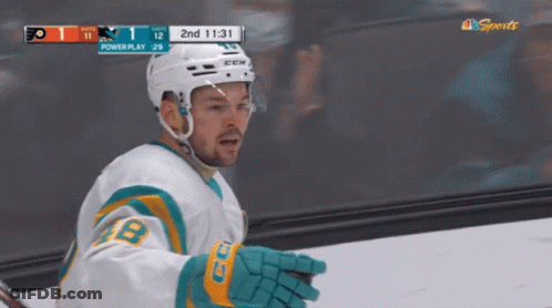 Hockey Player In Front Of Powerplay Scoreboard GIF
