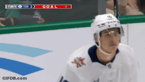 Hockey Player In Front Of Scoreboard Saying Tor 2 Goal GIF