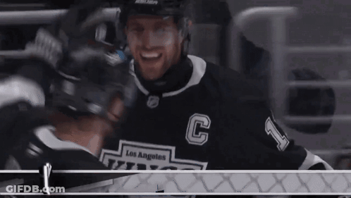 Hockey Player In Los Angeles Jersey Hugging Another Player GIF