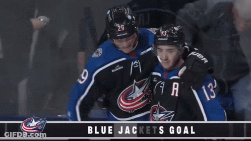Hockey Player In Number 10 Jersey Next To Player GIF