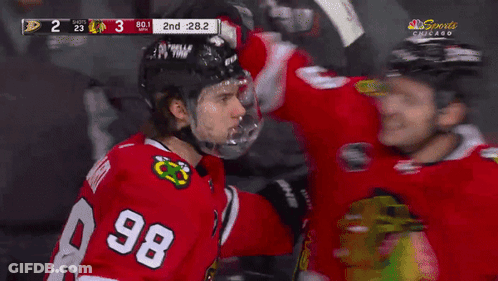 Hockey Player In Number 8 Jersey Next To Another Player GIF