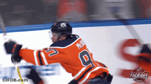 Hockey Player In Orange Jersey Number 9 GIF