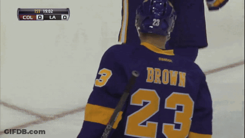 Hockey Player In Purple Jersey Number 23 GIF