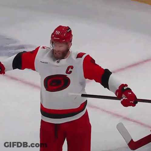 Hockey Player In Red And White Jersey With C GIF