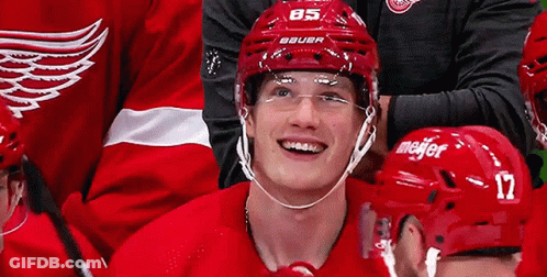 Hockey Player In Red Bauer Helmet Smiling GIF
