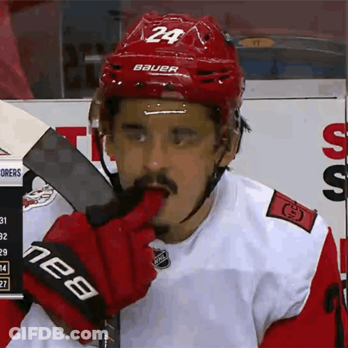 Hockey Player In Red Helmet Number 24 GIF