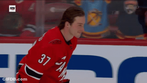 Hockey Player In Red Jersey Number 37 GIF