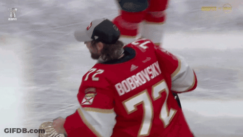 Hockey Player In Red Jersey Number 72 GIF
