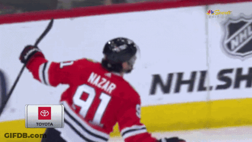 Hockey Player In Red Jersey Number 91 GIF