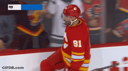 Hockey Player In Red Jersey Number 91 GIF