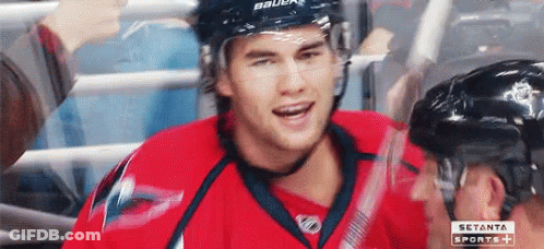 Hockey Player In Red Jersey Smiling And Talking GIF