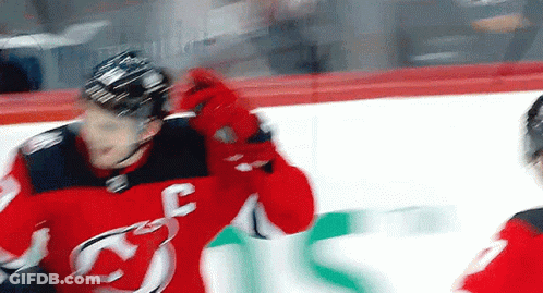 Hockey Player In Red Jersey With Letter F On Ice GIF