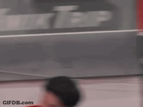 Hockey Player In Red Jersey With W On Helmet GIF