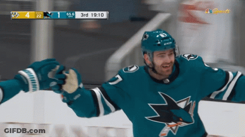 Hockey Player In Sharks Jersey Celebrates With Teammates GIF