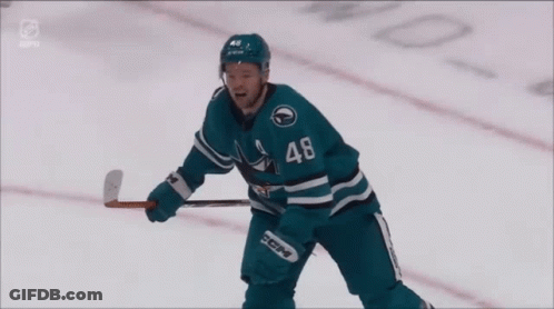 Hockey Player In Sharks Jersey Raising Arms GIF