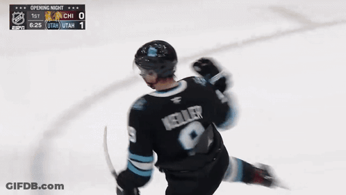 Hockey Player In Utah Jersey Holding Stick GIF
