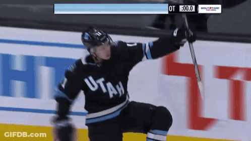 Hockey Player In Utah Jersey Holding Stick GIF
