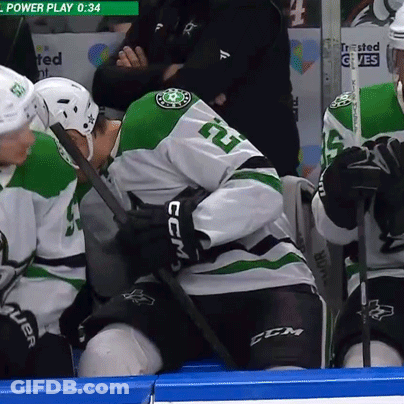 Hockey Player In White And Green Jersey Number 5 GIF