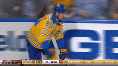 Hockey Player In Yellow And Blue Uniform Number 85 GIF