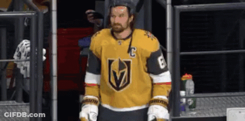 Hockey Player In Yellow Jersey And Gloves In Locker Room GIF